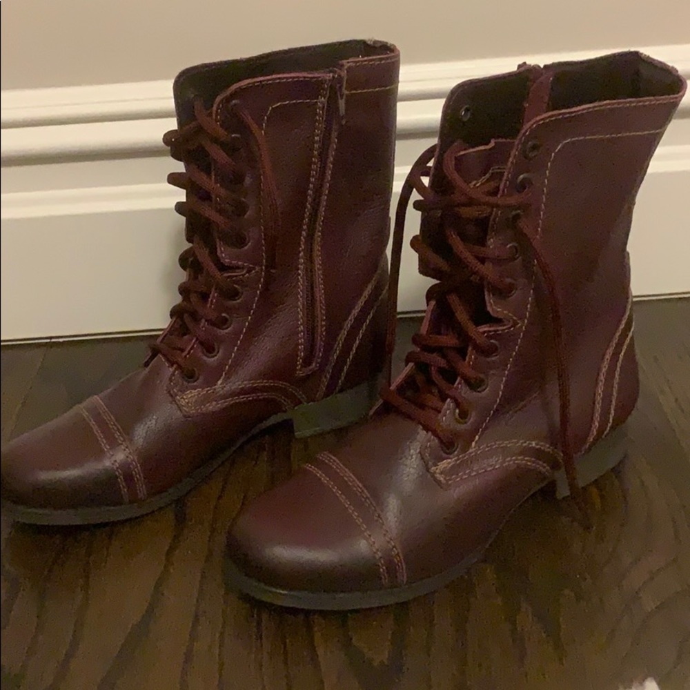 Maroon Steve Madden combat boots.